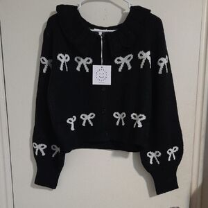 Elegant Black Cardigan with White Bow Accents